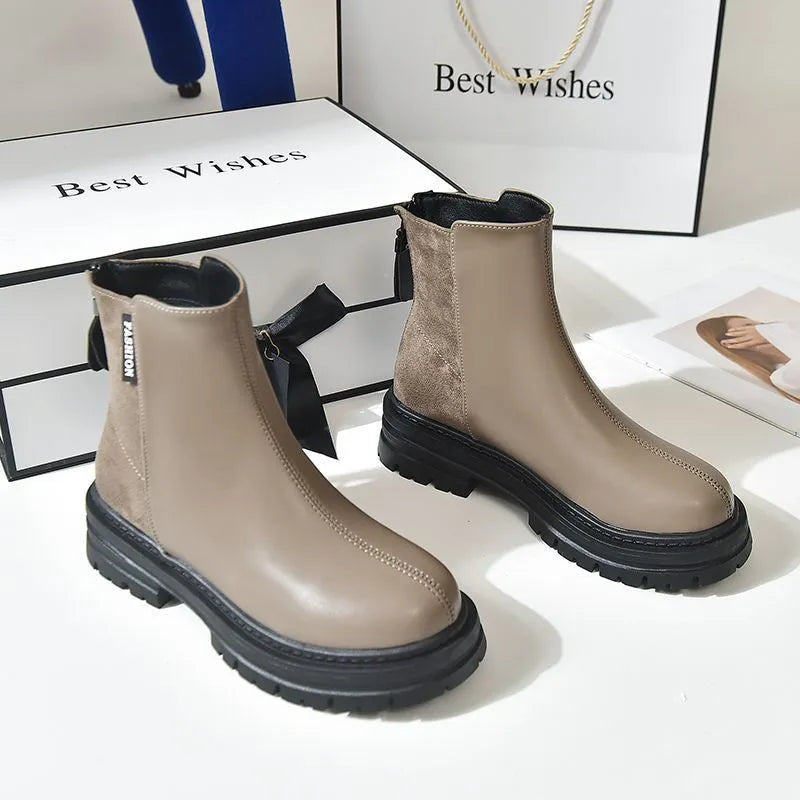Large size women's platform Martin boots in solid black with rubber sole, low tube design