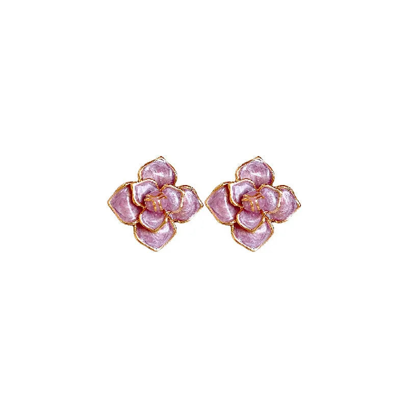 A pair of gold-plated flower stud earrings with a detailed purple oil-spot glaze finish on the petals.