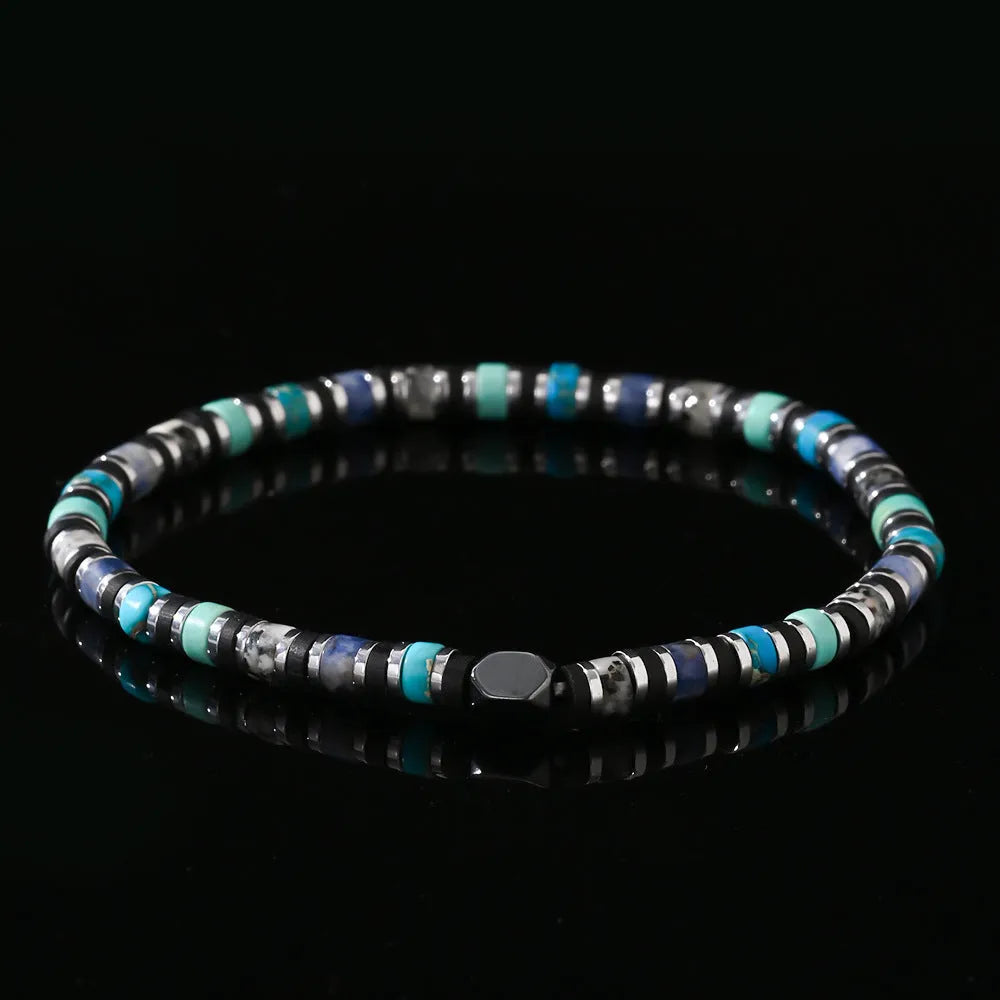 Close-up of a hand-woven cylindrical bohemian bracelet made from natural semi-precious stones in geometric patterns