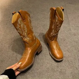 Brown women's embroidered Martin boots with mid-calf length, leather lining, and waterproof platform