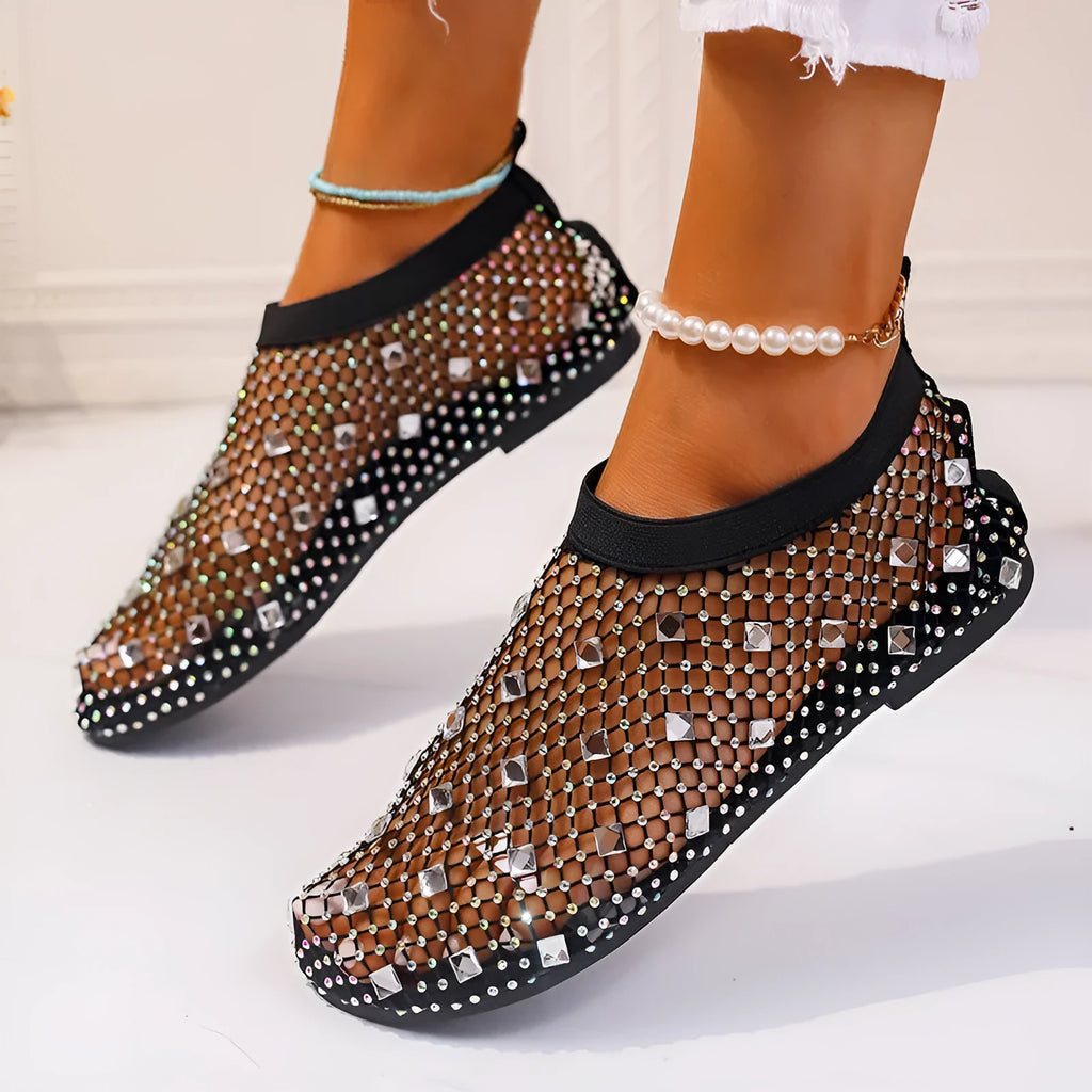 Women's colourful rhinestone flat sandals with mesh upper and rubber sole.