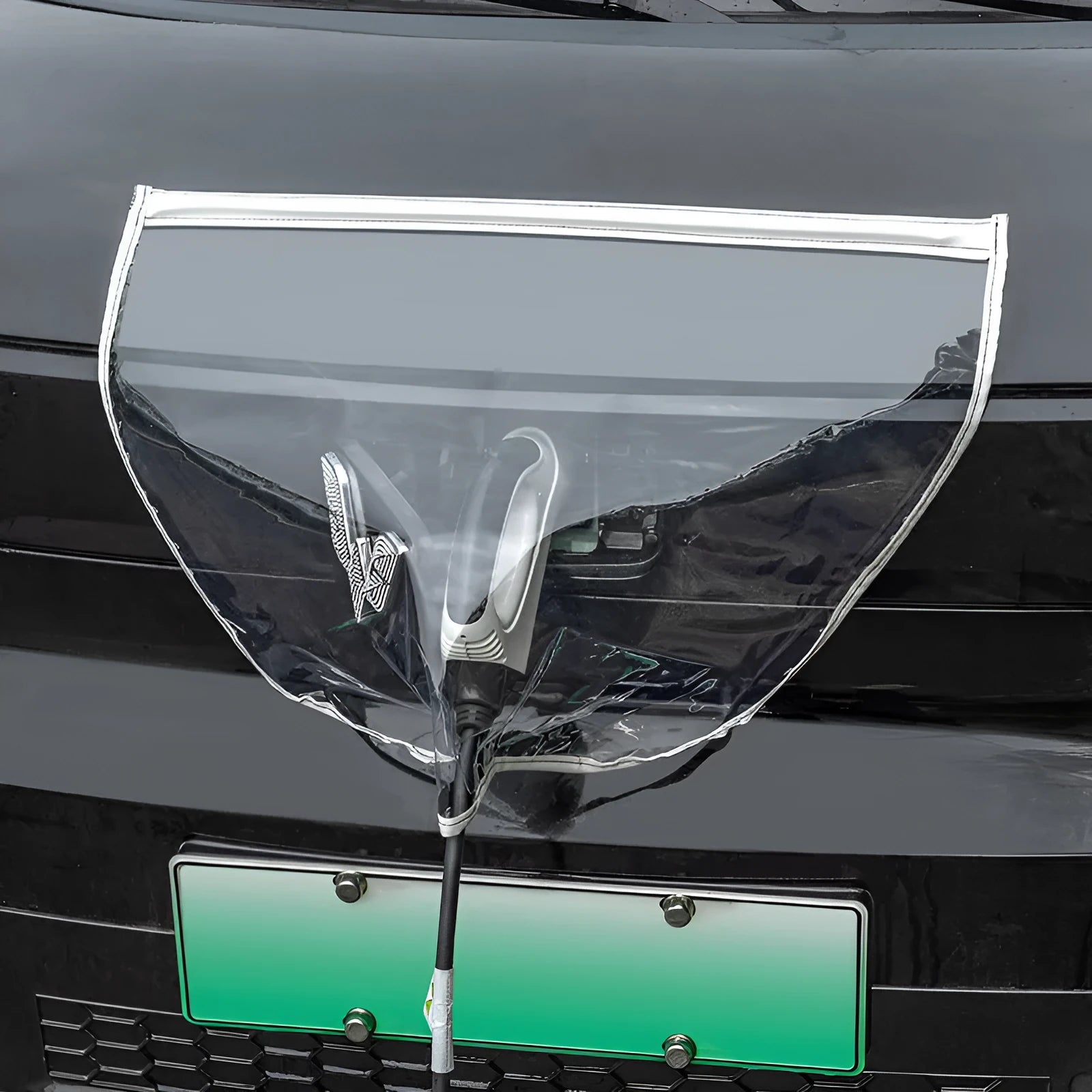 Black waterproof PVC cover with magnetic strips for an electric car charging gun port.