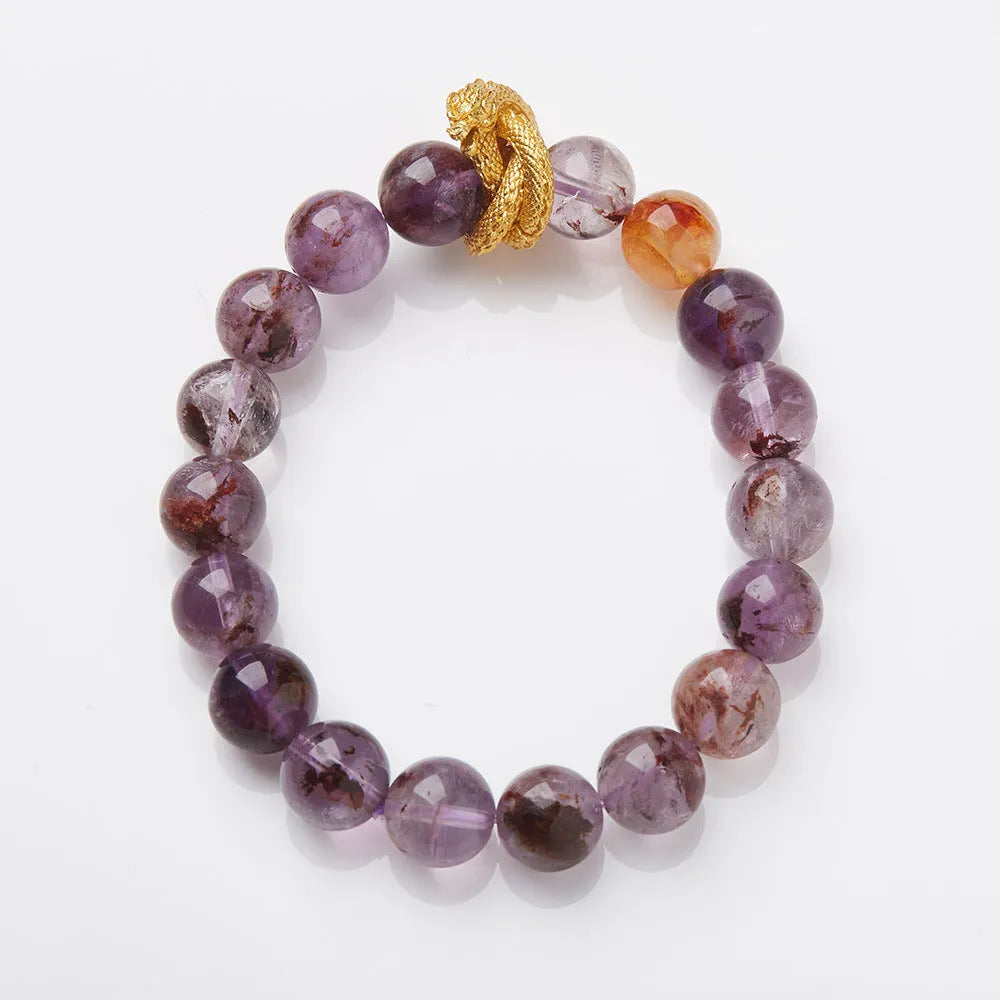 Purple cornucopia nine purple good luck crystal bracelet with zodiac animal motifs on wrist