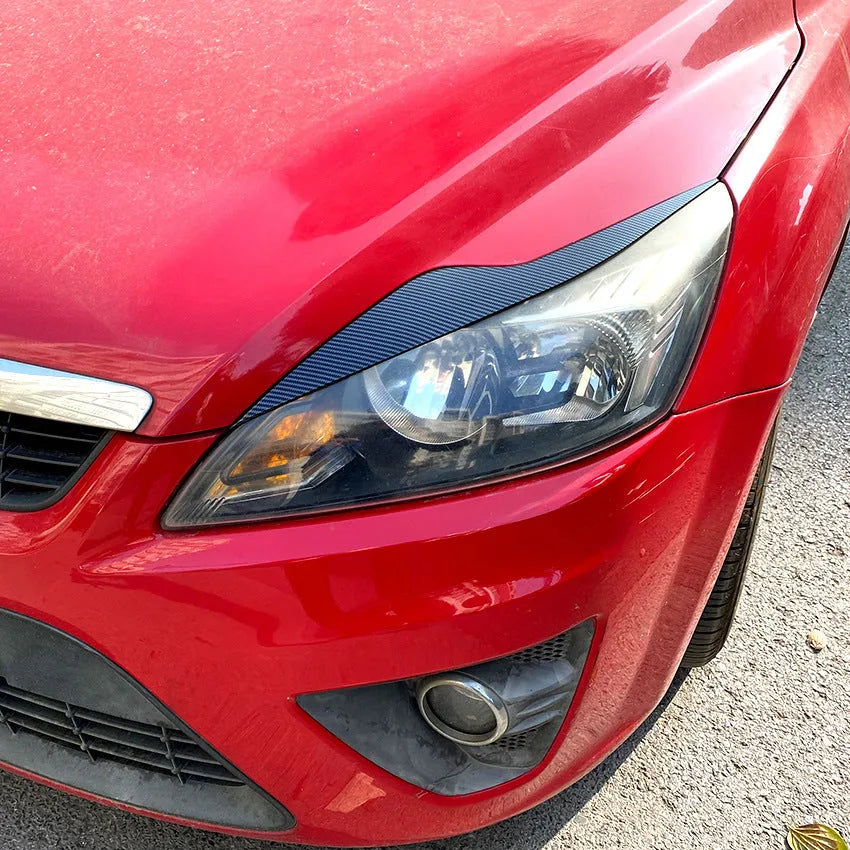 Ford Focus headlight eyebrow stickers in carbon fibre pattern and piano black options