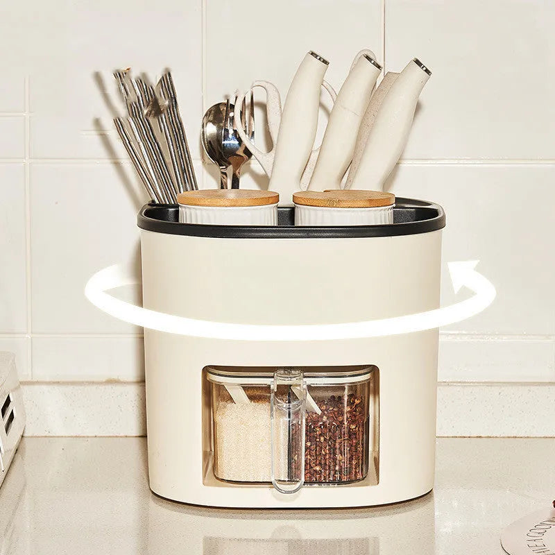 White rotating kitchen storage bucket with four-compartment spice box lid next to cutlery.