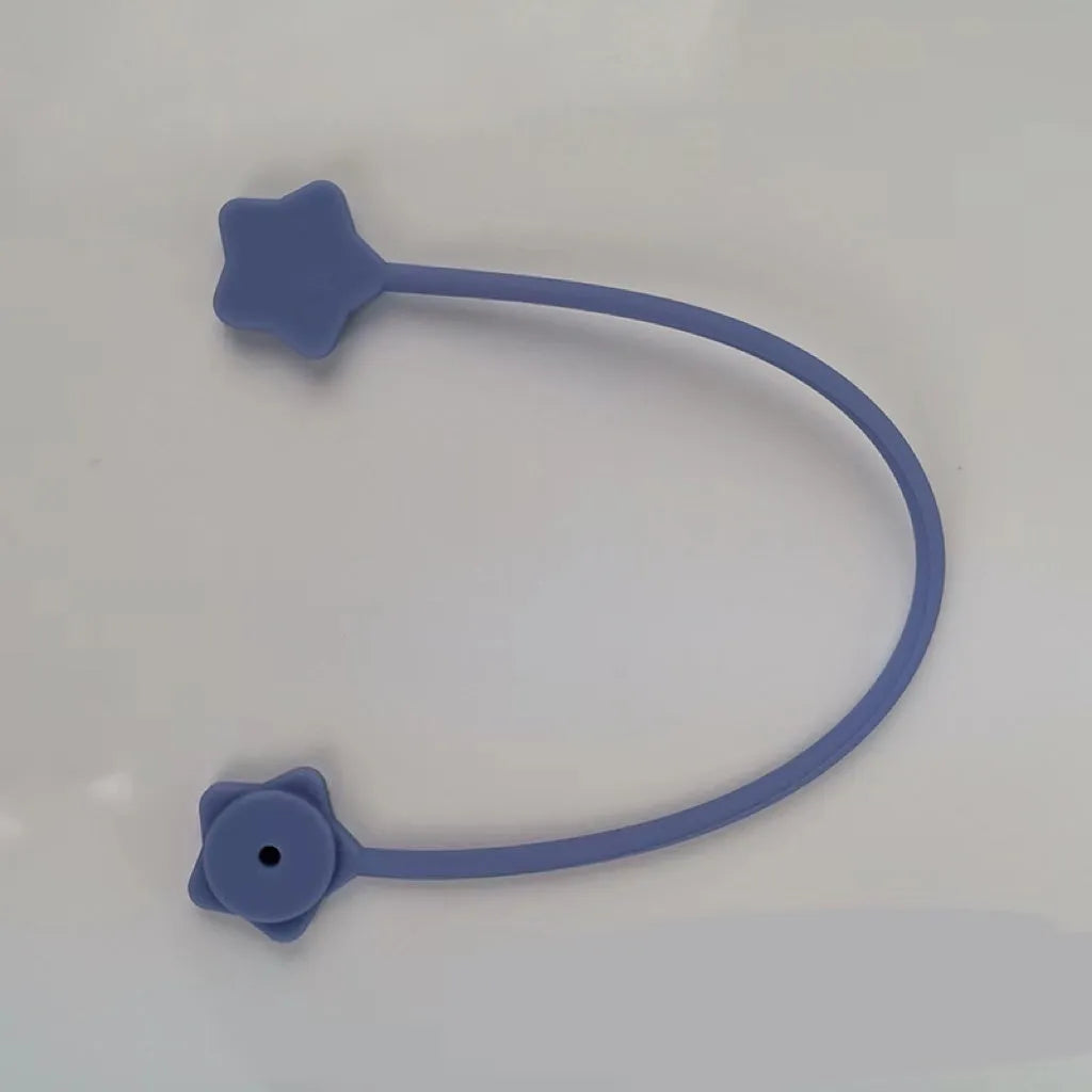 Small silicone and magnet wire winder clip in purple, shown holding a coiled white cable.
