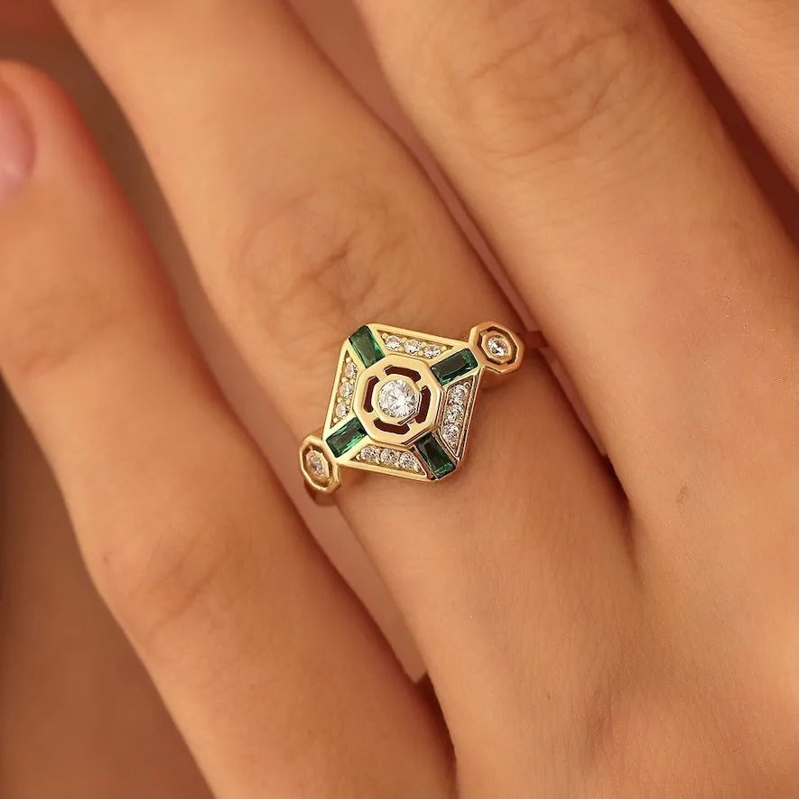 Square geometric ins-style women's ring with lvzuan coloured stones on a model's hand.