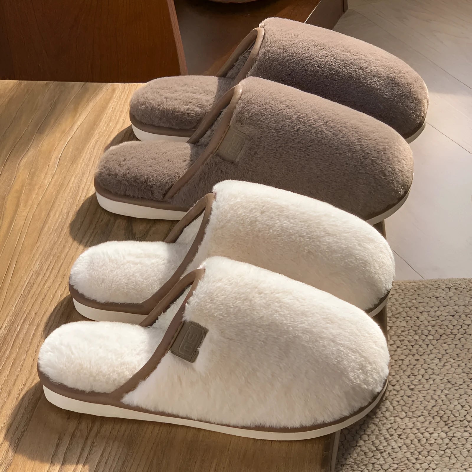 Pair of solid colour plush house slippers with a non-slip PVC sole, shown in coffee brown.
