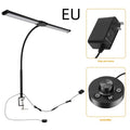 Black LED double-headed gooseneck remote control desk lamp with eye protection on a wooden desk top