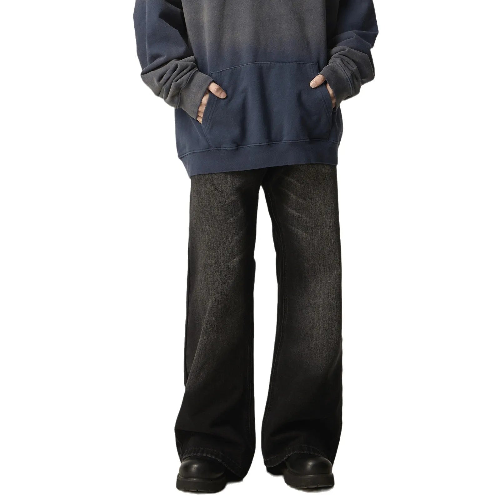 A pair of black loose-fit straight-leg jeans with a retro style on a white background.