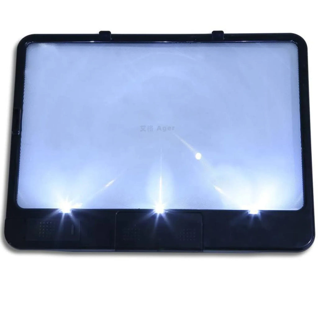 Black and white LED magnifying glass with 3x lens on a desk