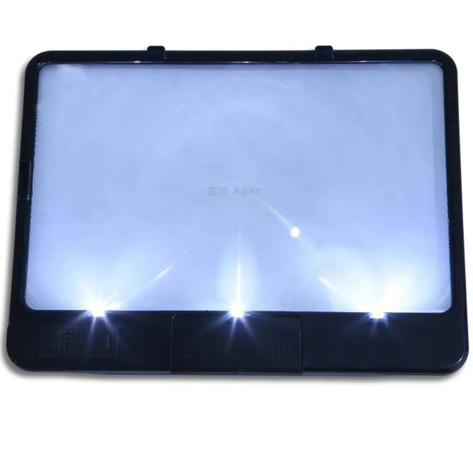 Black and white LED magnifying glass with 3x lens on a desk