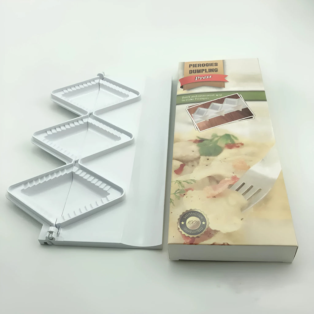 White plastic dumpling mold 28.5cm long on plain background