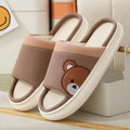 Pair of women's cartoon bear slippers with cotton linen upper and non-slip PVC sole, in light brown colour