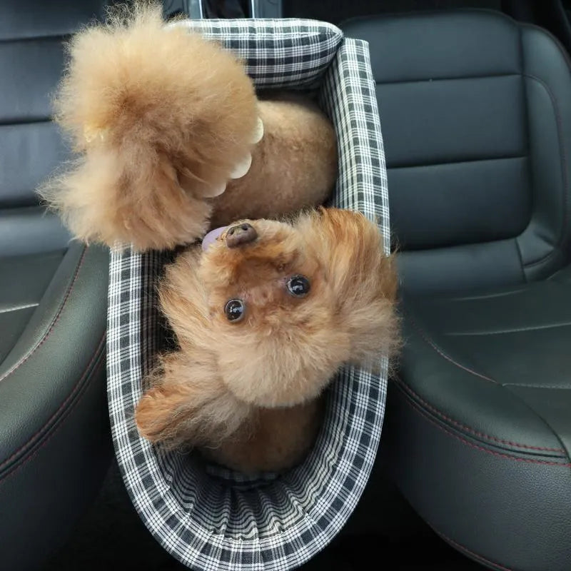 Portable pet car seat booster kennel in black grid with flip-top cover on car armrest, suitable for small dog or cat travel