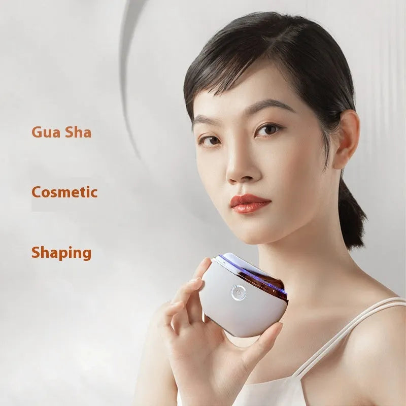 French pattern handheld beauty device for electric scraping, IPL light therapy, and microcurrent facial treatment.