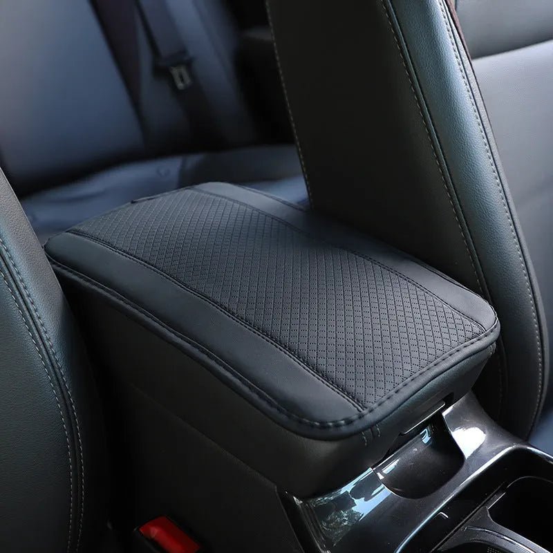 Black PU leather car armrest box cushion mat measuring 32 by 19 centimetres.
