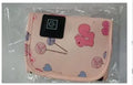 USB-powered baby bottle insulation cover in a blue dinosaur cartoon design.