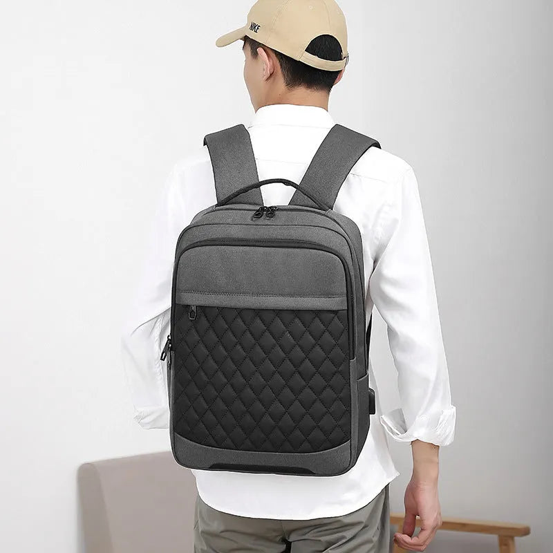 Men's Oxford cloth travel backpack in solid colour with curved shoulder straps and diamond mesh detailing