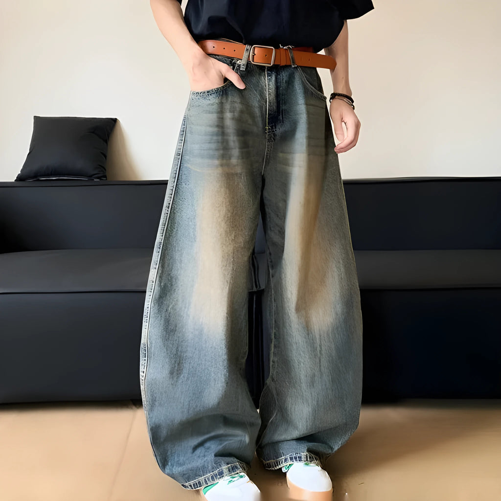 Men's distressed denim jeans in retro blue colour with wide-leg design and mid-waist fit