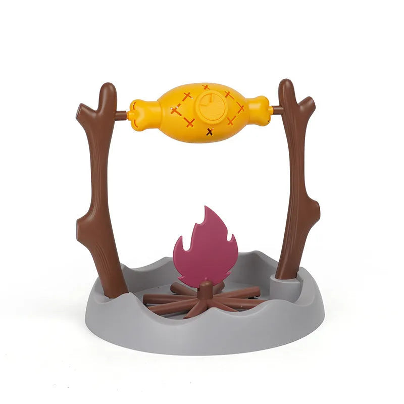 Barbecue-themed plastic tumbling cat treat feeder toy on a floor.