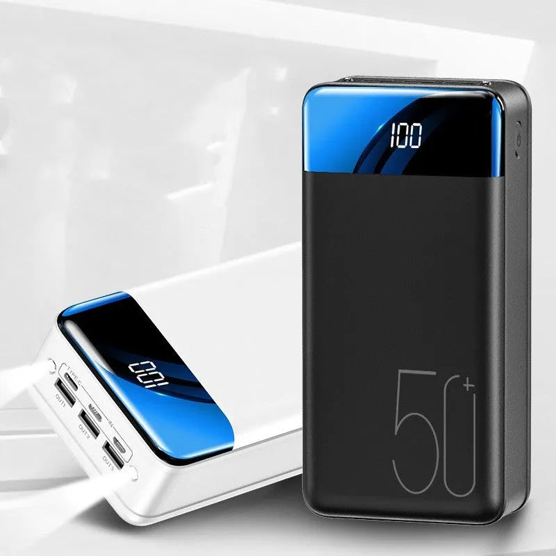 Black large capacity 50000mAh power bank with multiple USB ports on a white background