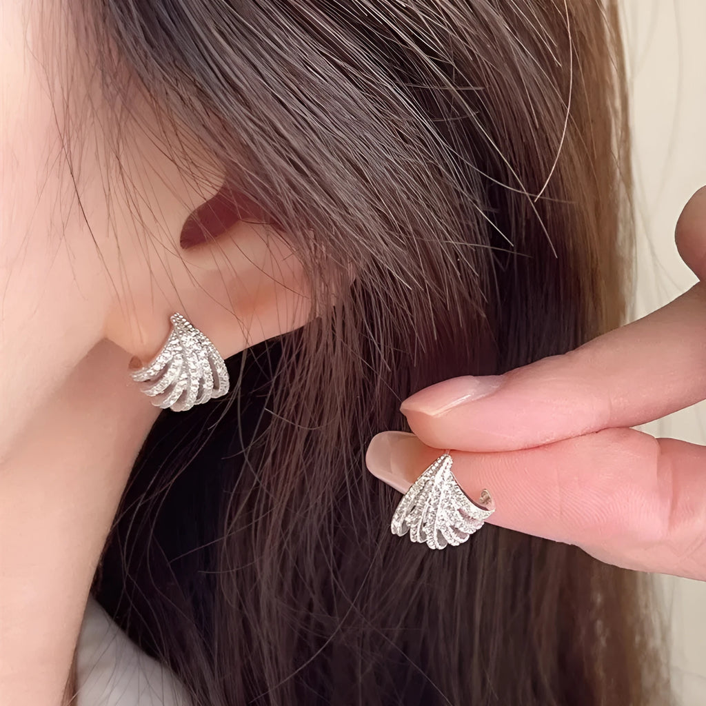 Geometric zircon earrings for women with a platinum electroplated finish.