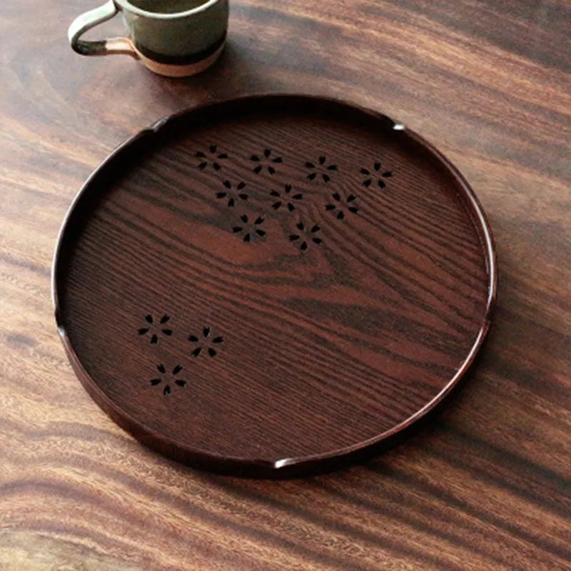 Wooden shallow plate with carved hollow cherry blossom pattern, 30cm in diameter.