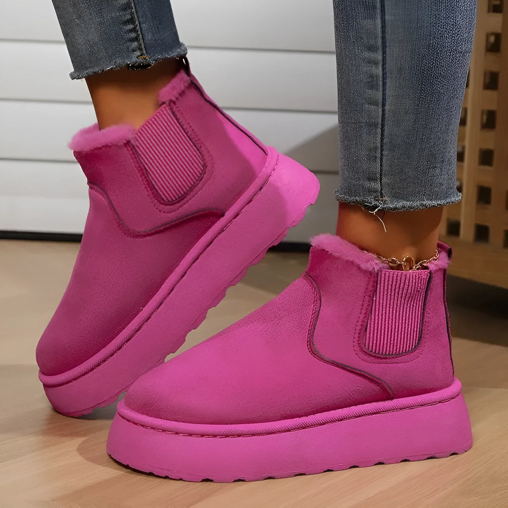 Women's winter snow boots in round toe style with thick rubber sole, cotton fabric upper, and velvet inner lining