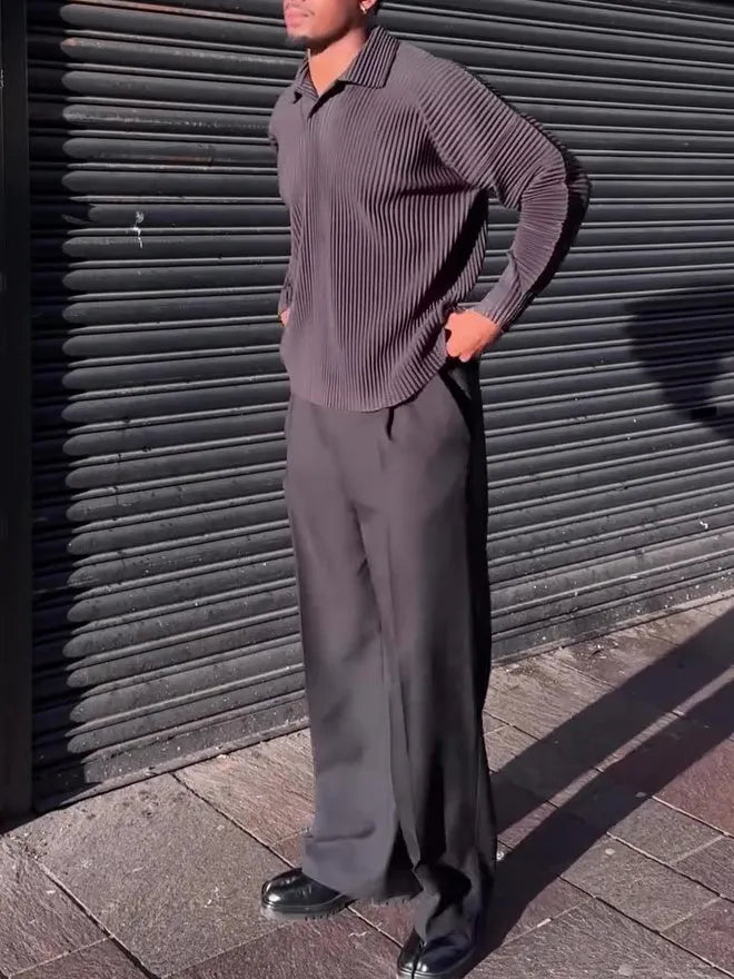 Man wearing a black pleated long-sleeved casual polyester top