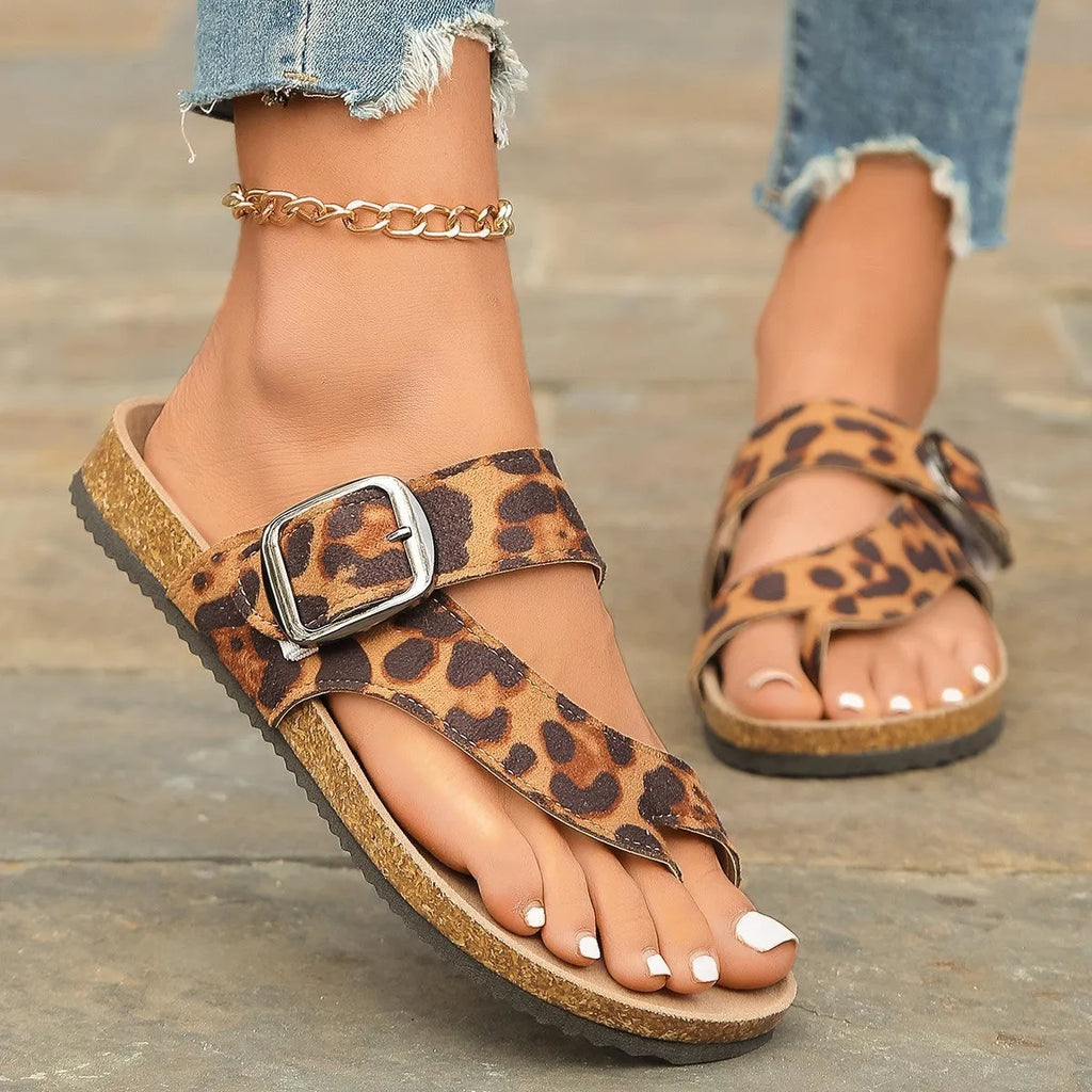 Leopard print Roman style slippers with covering toe and wooden sole.