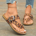 Leopard print Roman style slippers with covering toe and wooden sole.