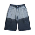 Blue tie-dye gradient cropped jeans with loose fit and worn wash on a mid-waist