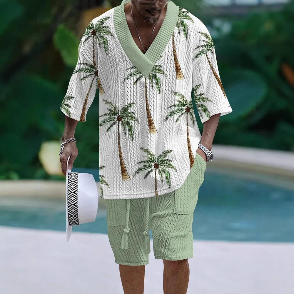 Man wearing a loose-fitting light blue short sleeve top and matching casual shorts from a two-piece suit set.