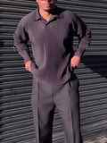 Man wearing a black pleated long-sleeved casual polyester top