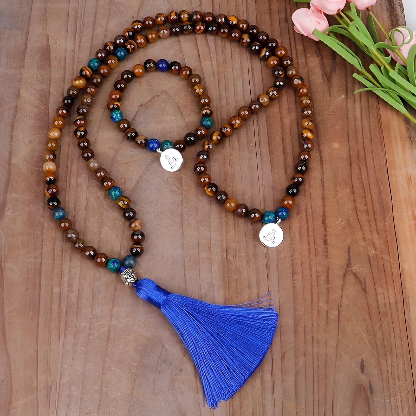 Handmade tiger eye stone bead necklace with Buddha head pendant and tassel on women model
