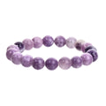 Purple natural stone elastic bead bracelet with geometric beads on wrist