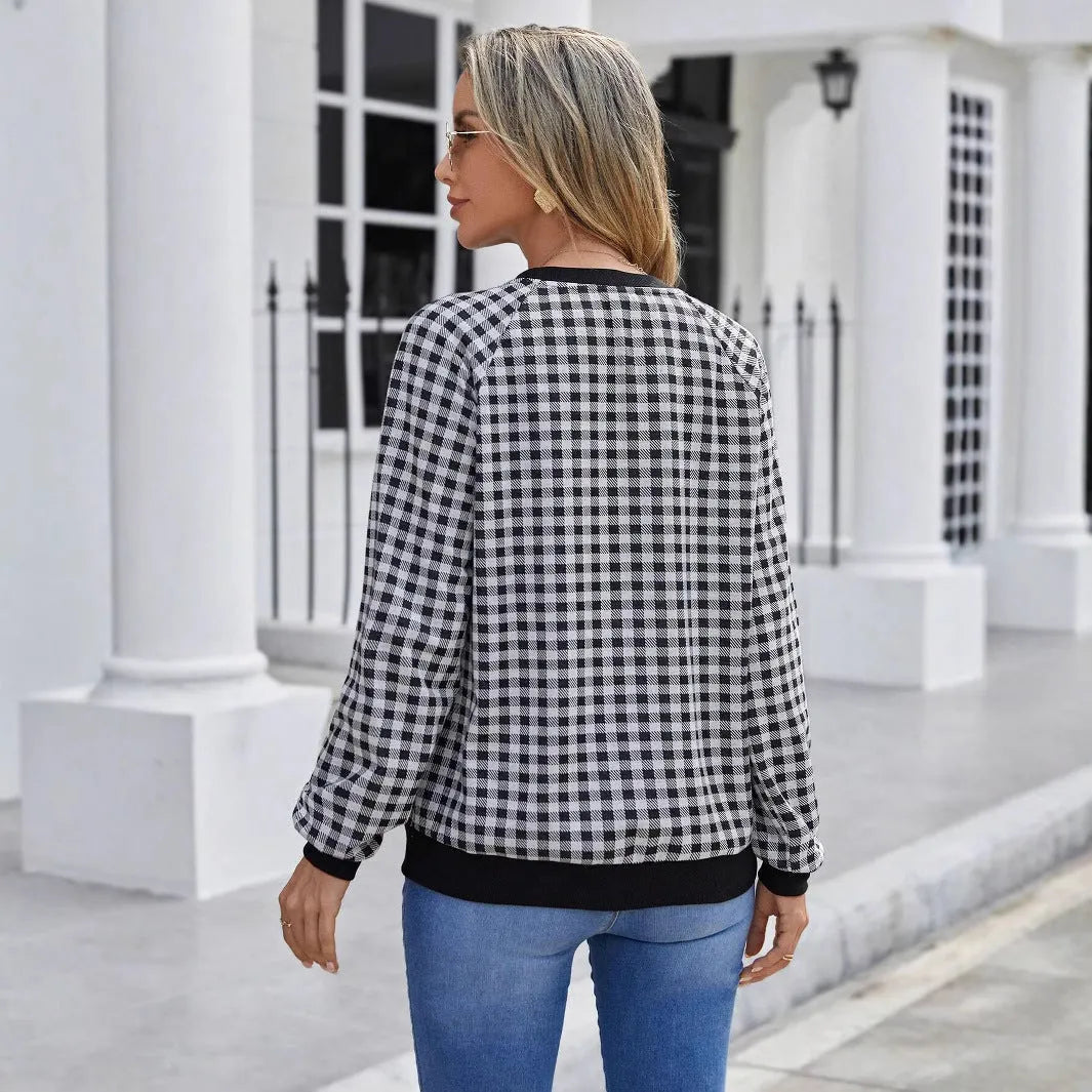 Black plaid stripe long sleeve pullover sweater laid flat, showing Japanese style pattern.