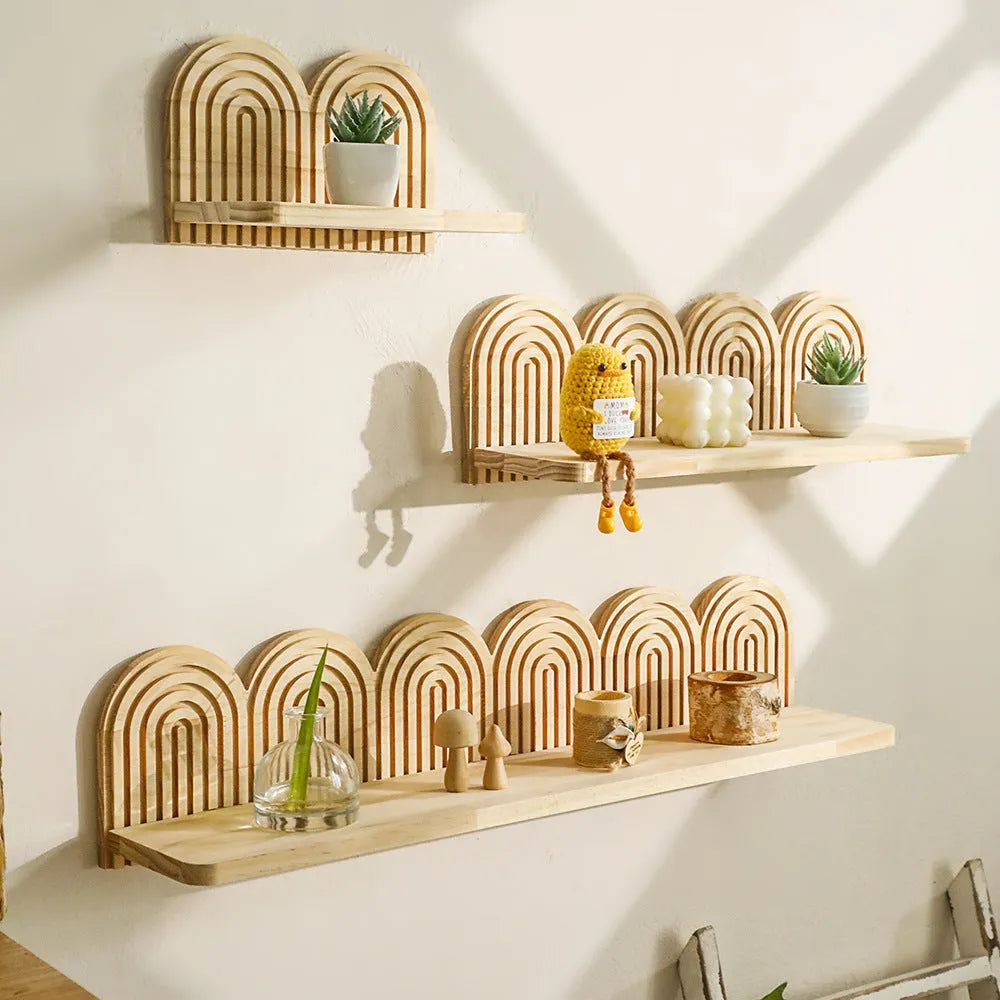 Solid wood multi-layer wall rack holding several flower pots for home decoration.
