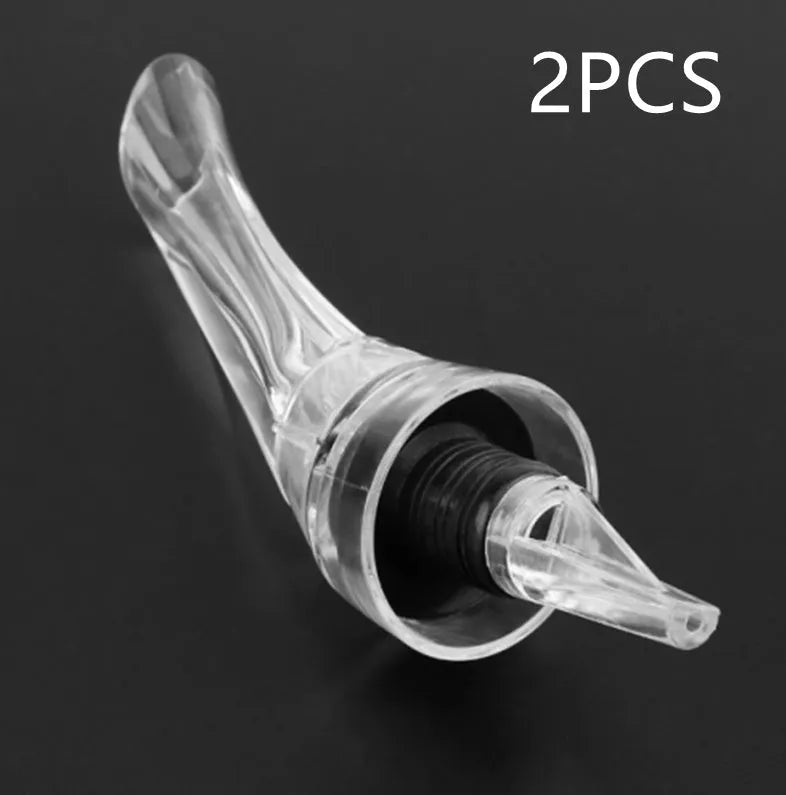 A clear acrylic wine aerator with a stainless steel filter, measuring 16cm long.