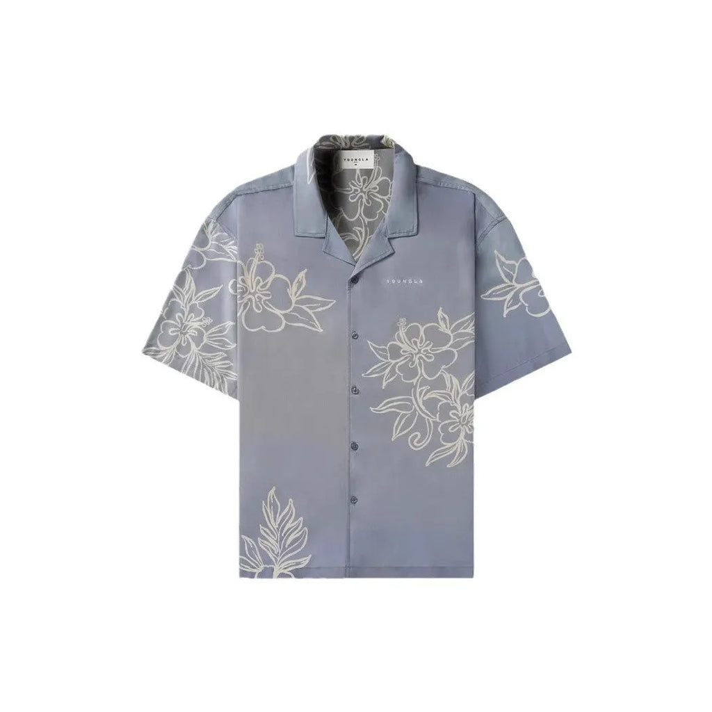 Man's loose-fitting printed short sleeve top in a light colour, showing cardigan style and floral pattern detail.