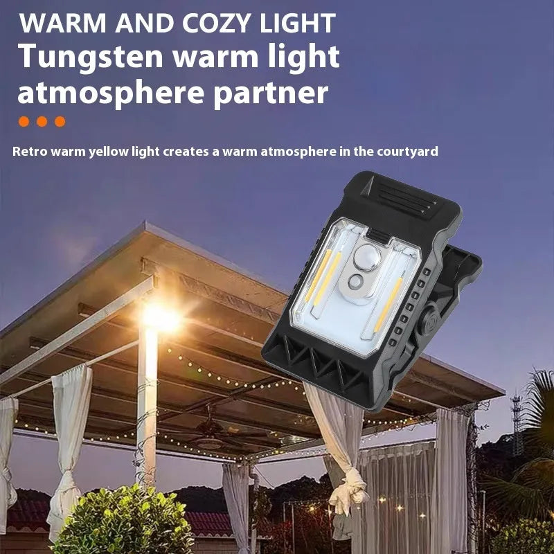 White intelligent motion sensor clip lamp mounted on a shelf edge.