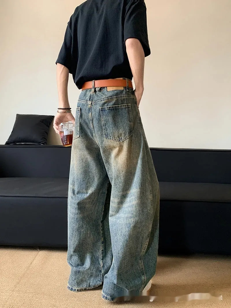 Men's distressed denim jeans in retro blue colour with wide-leg design and mid-waist fit
