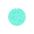 Round silicone pet licking mat in blue colour with suction cup base on a tile floor.