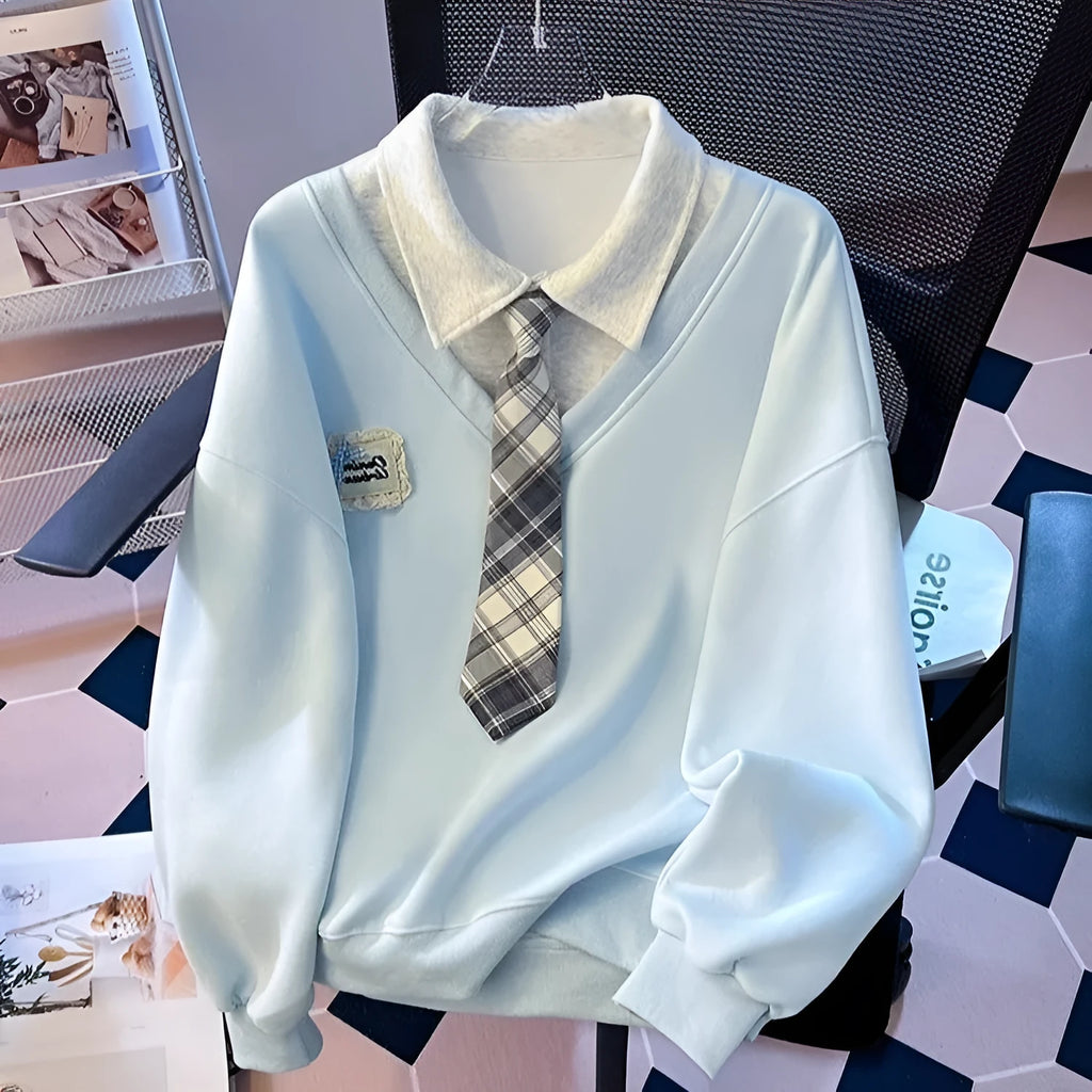 Women's fake two-piece sleeveless sweater top with tie polo collar and plush fabric, blue or gray, cropped length.