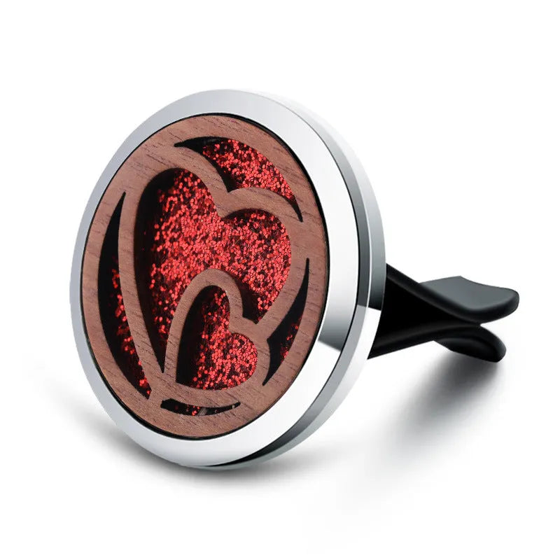 Round car vent aromatherapy clip in alloy wood construction showing hollow centre for incense