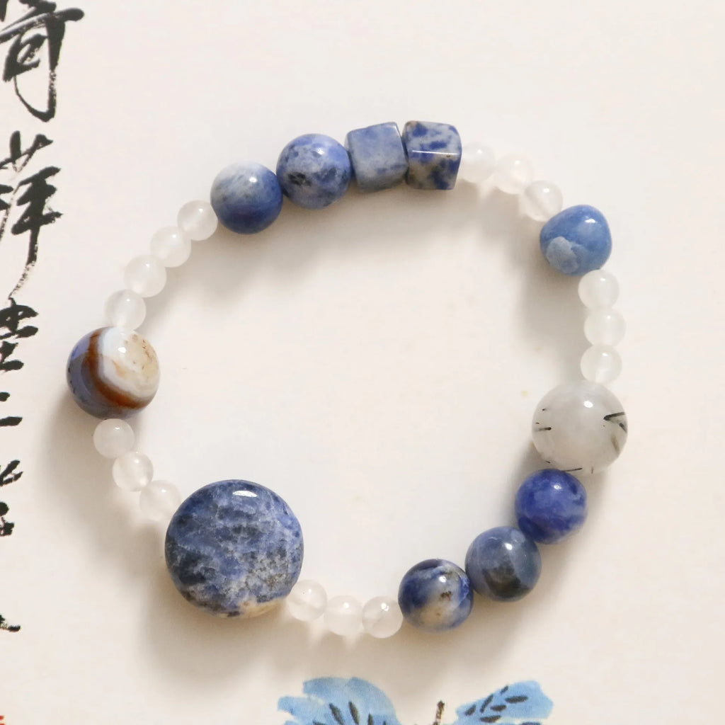 Hand-woven natural blue point stone and black hair crystal agate bracelet with geometric design