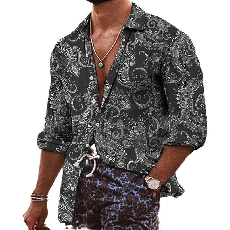 Man wearing a loose-fit bohemian shirt with a colourful 3D floral print pattern, long sleeves.