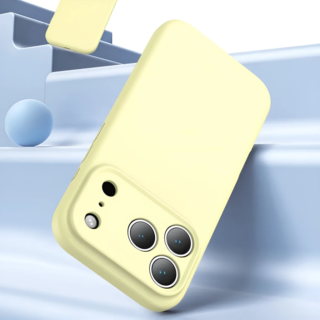 Simple solid colour liquid silicone phone case in antique white, fitted on an iPhone 17, showing shockproof and anti-fingerprint finish