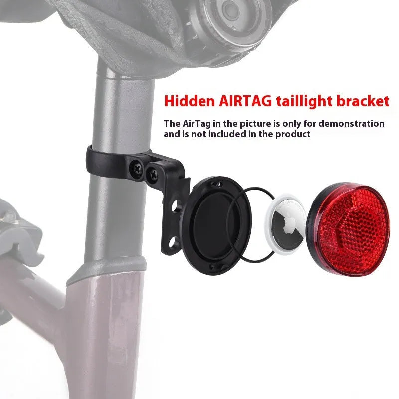 Plastic bicycle taillight with anti-theft bracket mounted on seat post showing red reflective panel